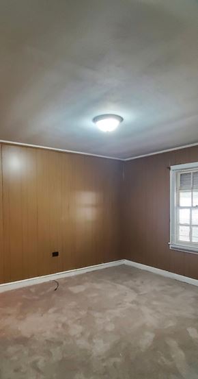 Prentiss house for rent - A room with a window and a light on the ceiling.