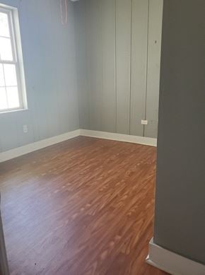 Hattiesburg apartment for rent - a room with a hard wood floor and a window