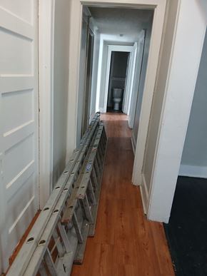 Louisville apartment for rent - a hallway with wood flooring and a ladder on the floor
