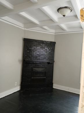 Louisville apartment for rent - the living room has a brick fireplace and a coffered ceiling