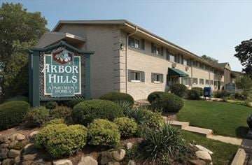 Madison apartment for rent - the arbor hills apartment homes sign in front of a building