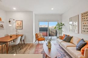 Los Angeles apartment for rent - the living room and dining area of an apartment with a couch and a table