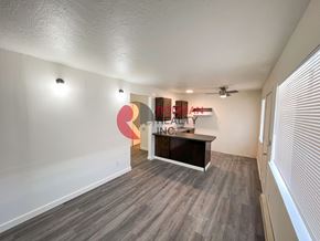 Kelso apartment for rent - A room with a reception desk and a wall with a sign that says "HEALTH INSURANCE".