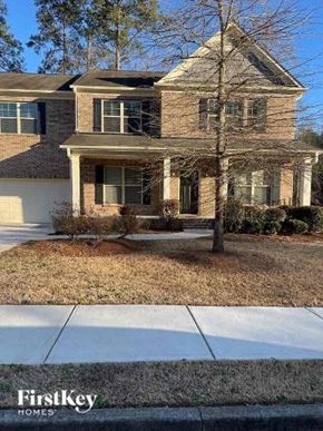 Powder Springs house for rent - a brick house with a sidewalk in front of it