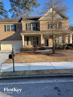 Powder Springs house for rent - a brick house with a parking meter on the sidewalk