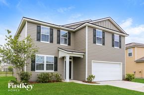 Jacksonville house for rent - A house with a garage door is for sale by FirstKey Homes.