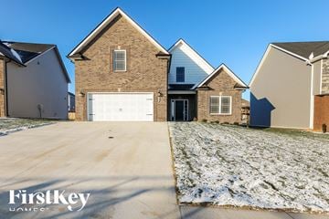 Clarksville house for rent - A house with a garage is shown in the image.