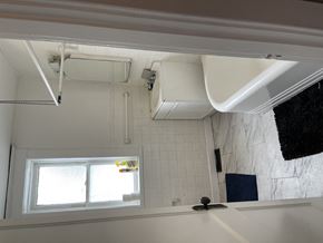 Saint Louis apartment for rent - A bathroom with a window and a shower.