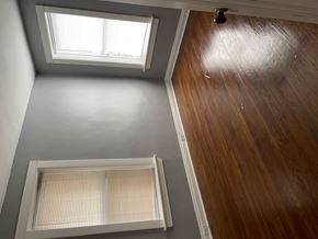 Saint Louis apartment for rent - A room with a skylight and a window with blinds.