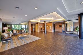 Minneapolis apartment for rent - A spacious lobby with brown leather couches.