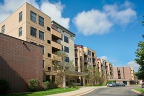 Minneapolis apartment for rent - Apartment buildings with a clear blue sky above them.
