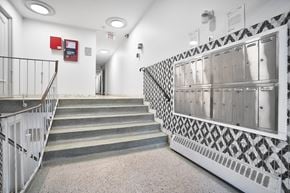 Montréal apartment for rent - A staircase with a black and white patterned railing.