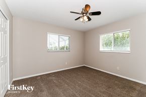 Cape Coral house for rent - the master bedroom has a carpeted floor and a ceiling fan