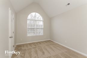Charlotte house for rent - the second bedroom is spacious and clean with vaulted ceilings and a large window