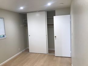 Oakland apartment for rent - A white door is open to reveal a small closet.