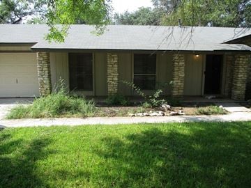 San Antonio house for rent - a house with a lawn and a sidewalk in front of it
