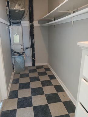Louisville apartment for rent - A black and white checkered floor in a small room.
