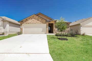 San Antonio house for rent - a home with a driveway and lawn in front of it