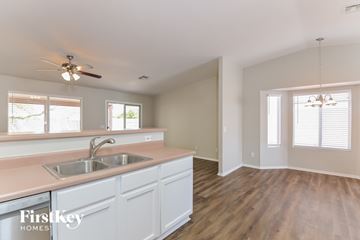 Tucson house for rent - A kitchen with a sink and a fan.