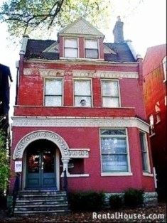 Louisville apartment for rent - A red house with a black door and a small porch.