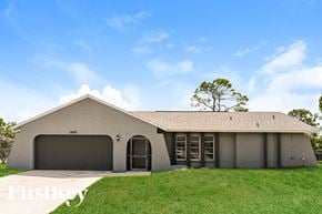 Fort Myers house for rent - A house with a garage and a driveway.