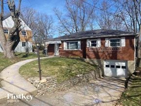 Cincinnati house for rent - a brick house with a sidewalk in front of it