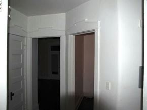 Louisville apartment for rent - a white room with a door open and a hallway