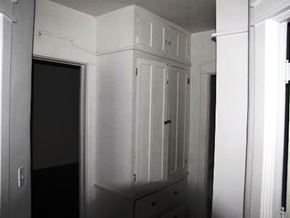 Louisville apartment for rent - a white cabinet in a room with a door