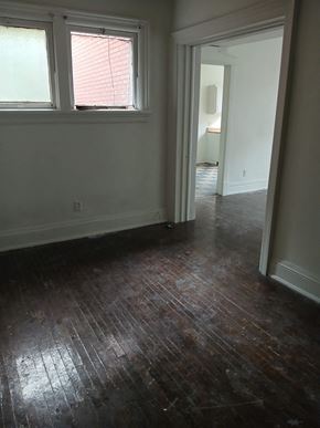 Louisville apartment for rent - a living room with a hard wood floor and a window