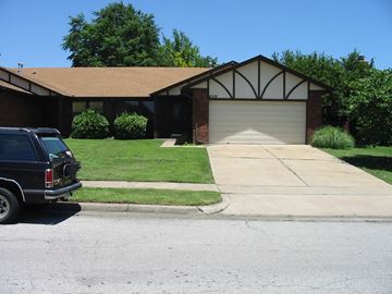 Tulsa house for rent - a house with a truck parked in front of it