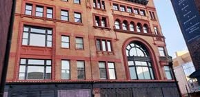 Louisville house for rent - a tall brick building with a lot of windows
