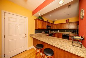 Louisville house for rent - a kitchen with a counter top and a door