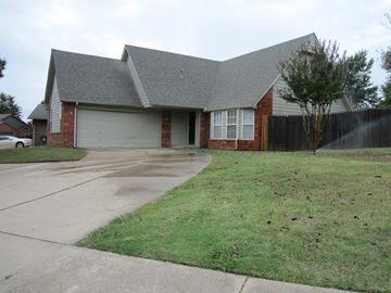 Tulsa house for rent - a house with a driveway in front of it