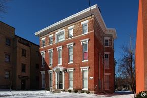 Louisville apartment for rent - a red brick building with snow in front of it