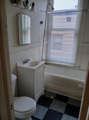 Louisville apartment for rent - a small bathroom with a sink toilet and bath tub