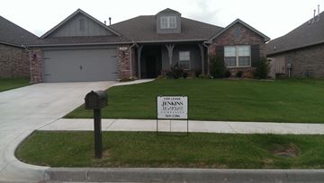 Bixby house for rent - a house with a foreclosure sign in the front yard