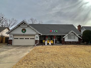 Tulsa house for rent - a view of the front of a white house with a grey roof
