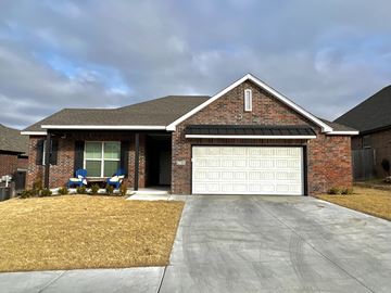 Bixby house for rent - a house with a white garage door in front of it