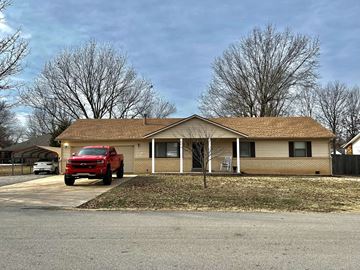 Broken Arrow house for rent - a house with a red truck parked in front of it