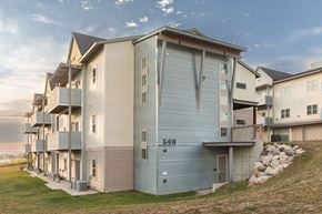 Watford City apartment for rent - A modern apartment building with the number 500 on the side.
