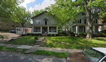Louisville apartment for rent - A brown car is parked on the street.
