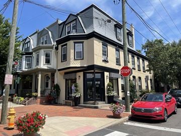 Wilmington apartment for rent - A red car is parked at a stop sign on a street.