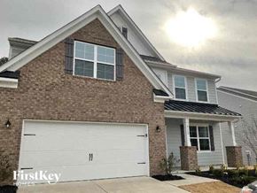 Denver house for rent - a brick house with a white garage door