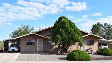 Cottonwood apartment for rent - a brown house with a tree in front of it