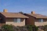 Cottonwood apartment for rent - Two houses with brown roofs and tan walls.
