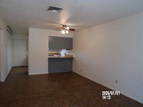 Cottonwood apartment for rent - A room with a ceiling fan and a cabinet.