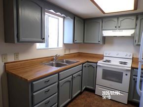 Cottonwood apartment for rent - A kitchen with a stove, sink, and cabinets.