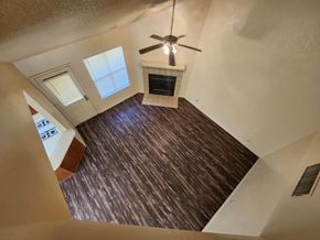 Killeen apartment for rent - A wood floor leads to a staircase in a house.