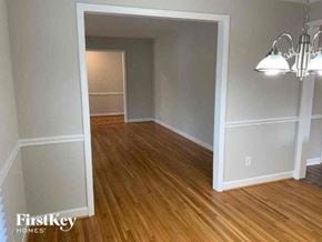 Charlotte house for rent - an empty living room with a wood floor