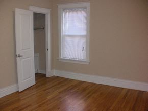 St. Louis apartment for rent - A room with a white door and a window with blinds.
